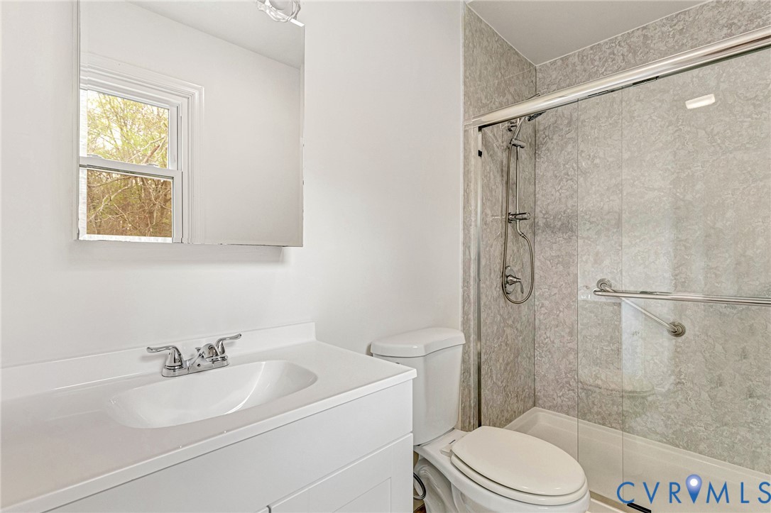9107 Mossy Brook Road Mechanicsville, VA 23116 - Photo 17 of 30 Bathroom with vanity and a stall shower
