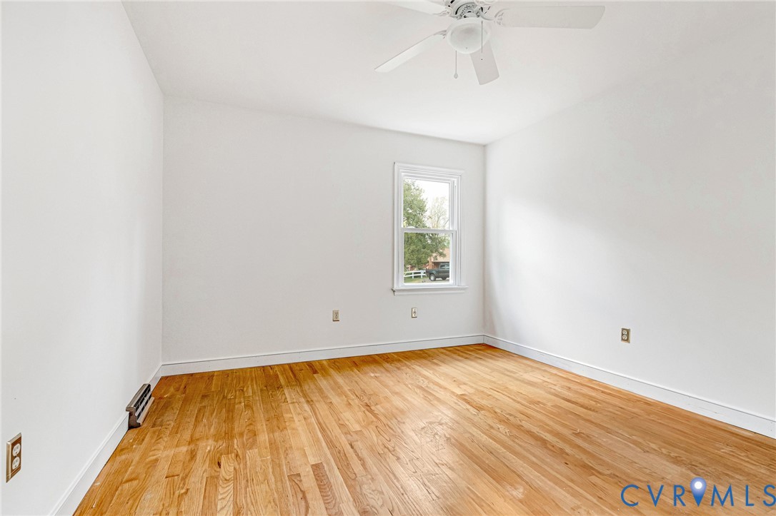 9107 Mossy Brook Road Mechanicsville, VA 23116 - Photo 20 of 30 Spare room with light wood-style flooring and a ce