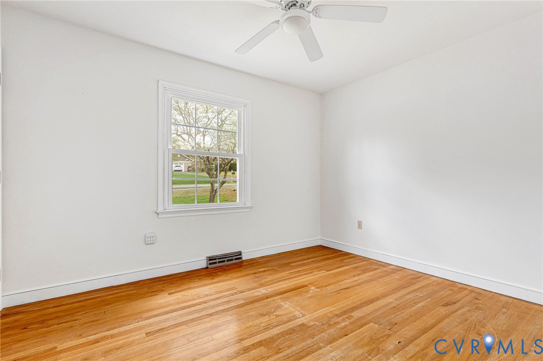 9107 Mossy Brook Road Mechanicsville, VA 23116 - Photo 22 of 30 Unfurnished room with light wood-type flooring and