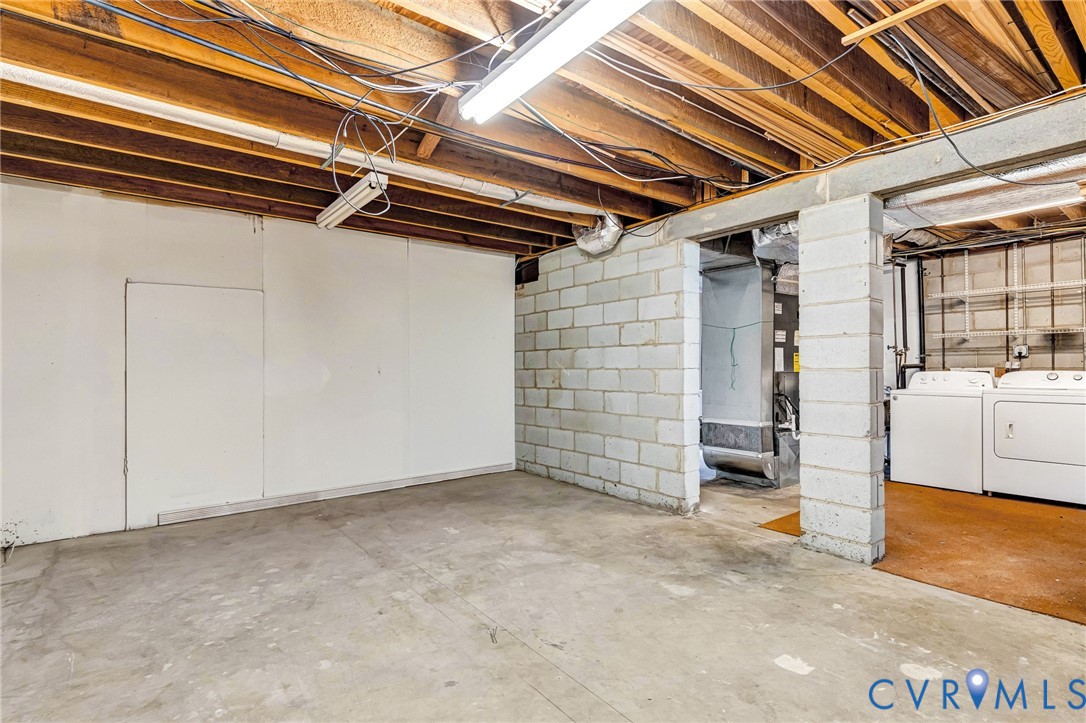 9107 Mossy Brook Road Mechanicsville, VA 23116 - Photo 25 of 30 Unfinished basement with washing machine and cloth