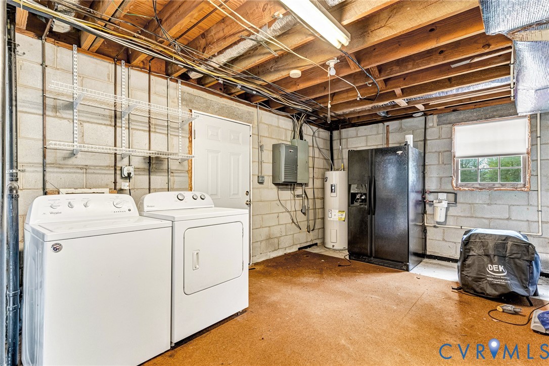 9107 Mossy Brook Road Mechanicsville, VA 23116 - Photo 26 of 30 Laundry room featuring washing machine and clothes