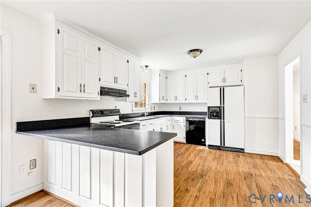 9107 Mossy Brook Road Mechanicsville, VA 23116 - Photo 8 of 30 Kitchen with white fridge with ice dispenser, a pe