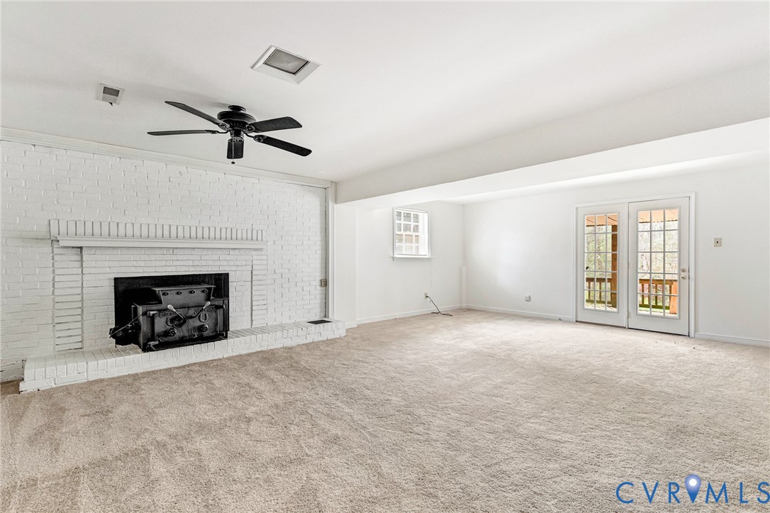 9107 Mossy Brook Road Mechanicsville, VA 23116 - Photo 10 of 30 Unfurnished living room with ceiling fan, a firepl