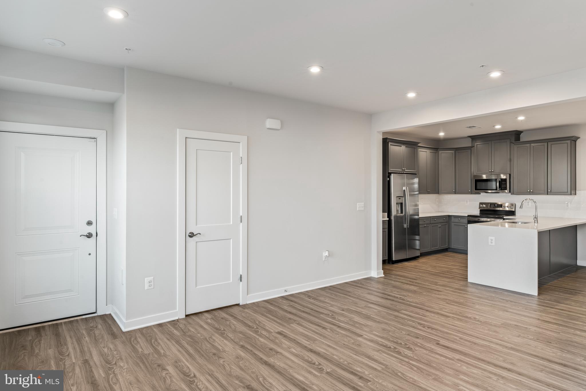 20320 Newfoundland Square Ashburn, VA 20147 - Photo 7 of 53 Open living/dining/kitchen