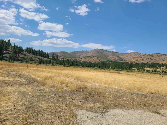 a view of an ocean and a mountain