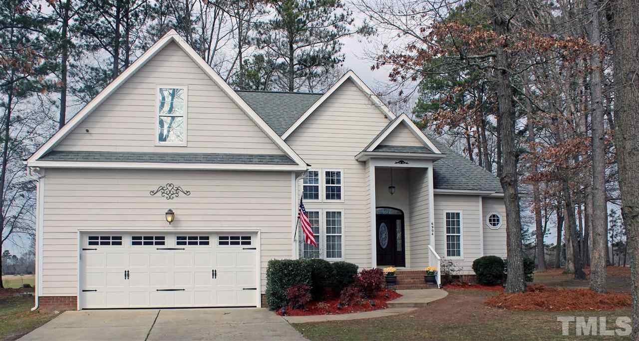 6904 Field Hill Road Raleigh, NC 27603 - Photo 1 of 25 a front view of a house with garage