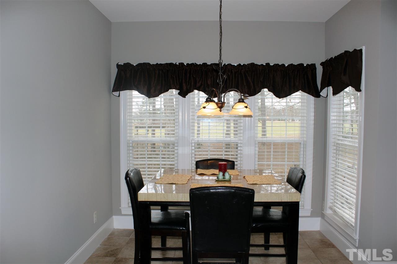 6904 Field Hill Road Raleigh, NC 27603 - Photo 14 of 25 a view of a dining room with furniture and window