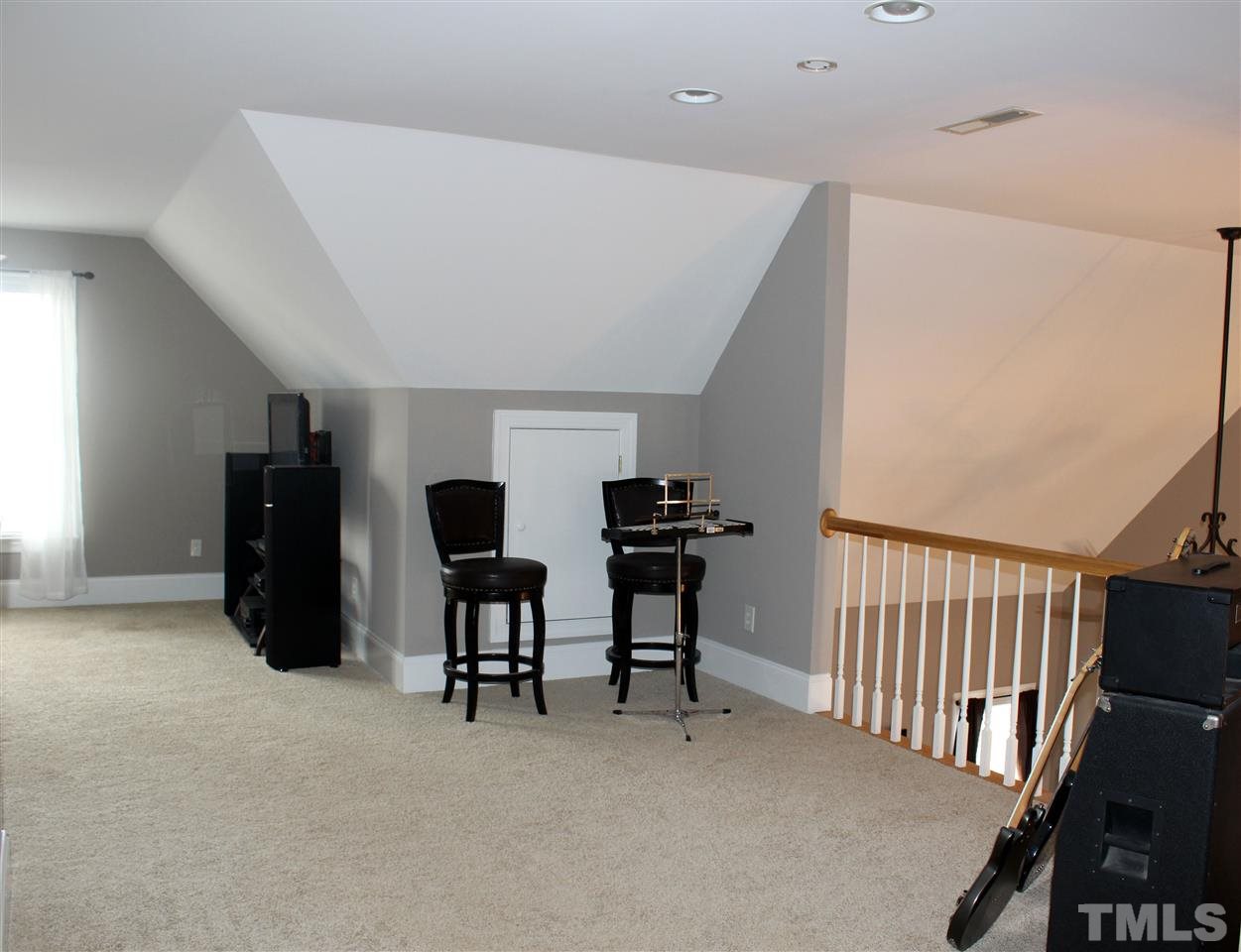 6904 Field Hill Road Raleigh, NC 27603 - Photo 23 of 25 a view of a workspace with furniture and a window