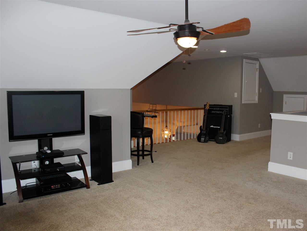 6904 Field Hill Road Raleigh, NC 27603 - Photo 24 of 25 a view of a livingroom with furniture and a flat screen tv