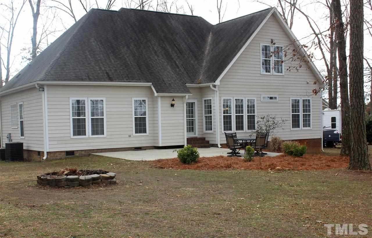 6904 Field Hill Road Raleigh, NC 27603 - Photo 4 of 25 a view of a house with backyard and sitting area