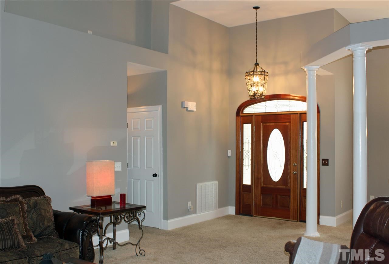 6904 Field Hill Road Raleigh, NC 27603 - Photo 7 of 25 a workspace with chandelier fan and a mirror
