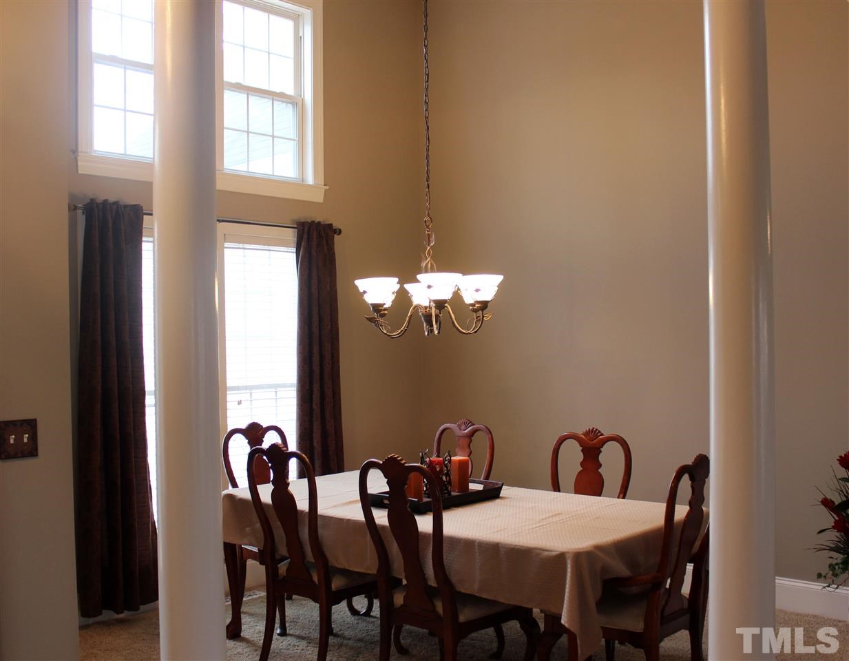 6904 Field Hill Road Raleigh, NC 27603 - Photo 9 of 25 a view of a dining room with furniture and window
