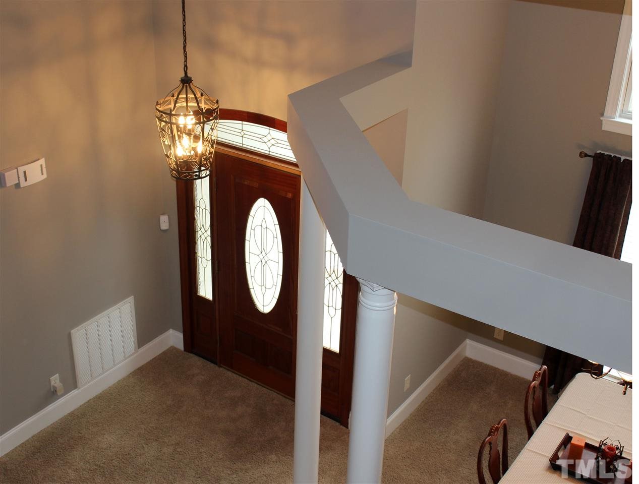 6904 Field Hill Road Raleigh, NC 27603 - Photo 10 of 25 a view of a livingroom with furniture and chandelier