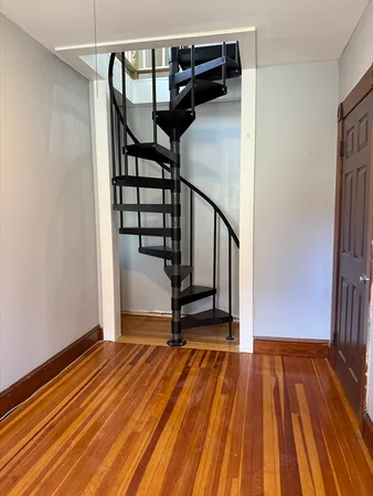 a view of entryway with wooden floor