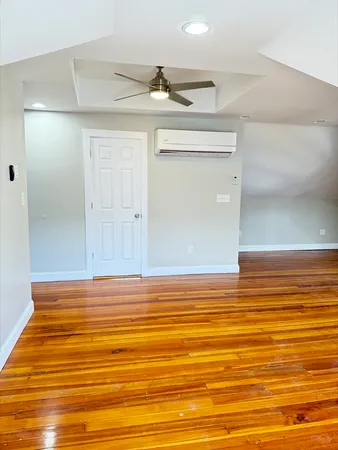 a view of room and wooden floor