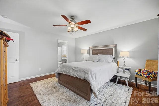 a bathroom with a sink mirror and vanity