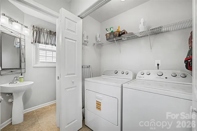 a bathroom with a sink a mirror and a window