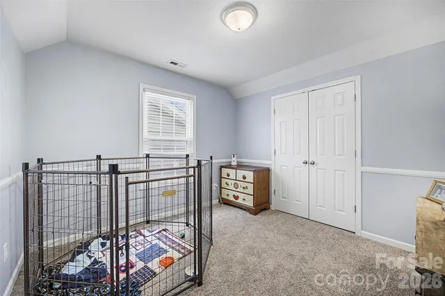 a bathroom with a sink vanity mirror and toilet