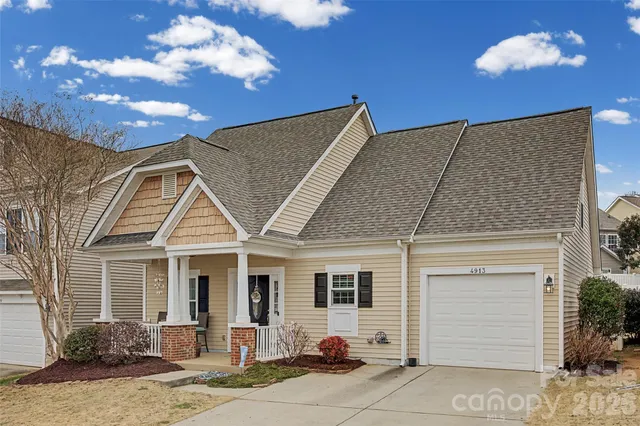 an aerial view of a residential houses with outdoor space