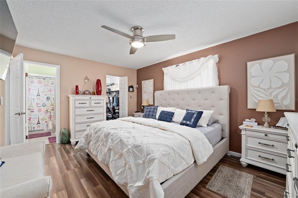 10182 Southwest 88th Court Ocala, FL 34481 - Photo 17 of 31 a bedroom with a bed and dresser