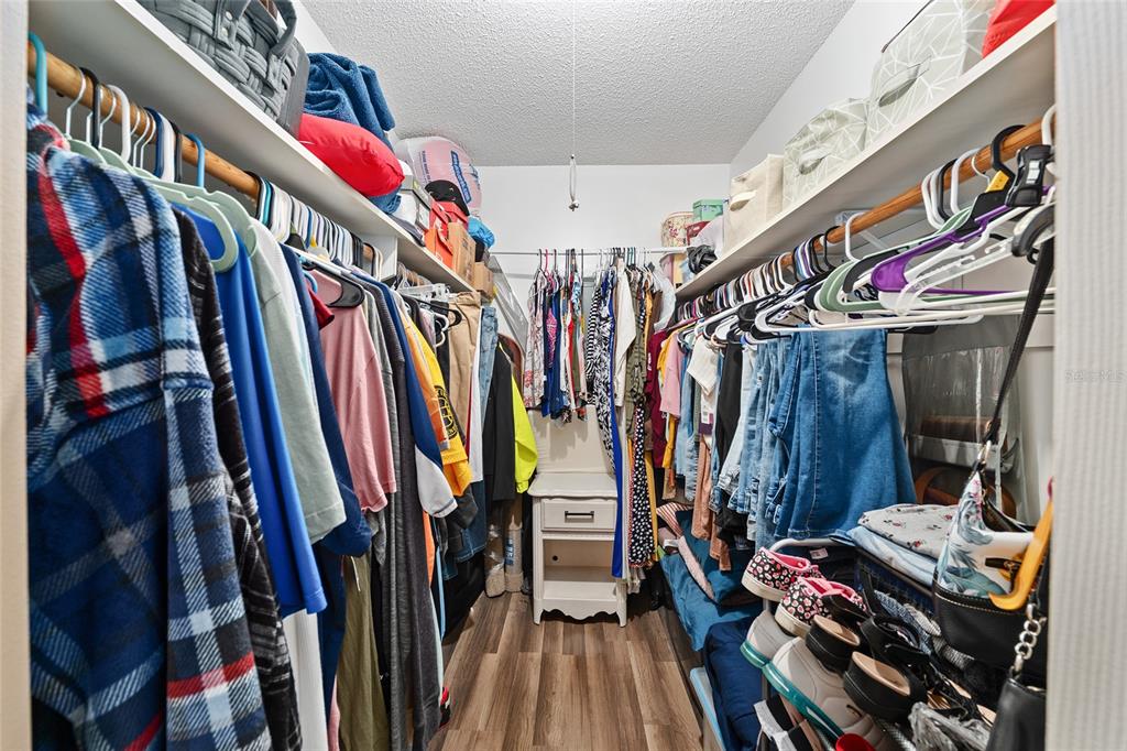 10182 Southwest 88th Court Ocala, FL 34481 - Photo 18 of 31 a view of walk in closet with clothes