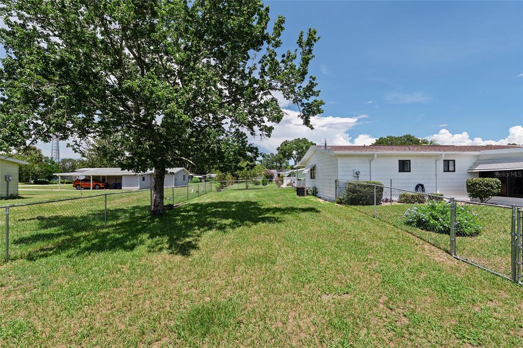 10182 Southwest 88th Court Ocala, FL 34481 - Photo 30 of 31 a front view of a house with a yard