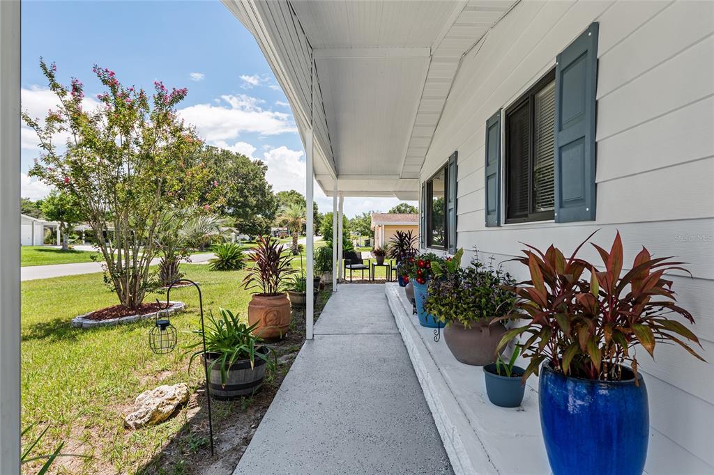 10182 Southwest 88th Court Ocala, FL 34481 - Photo 7 of 31 a potted plant sitting in front of a house