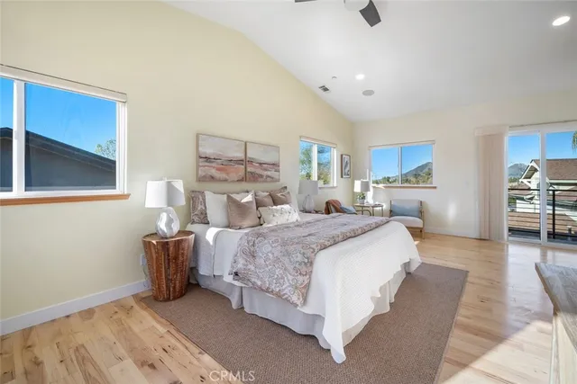 a bed room with a bed and a chair