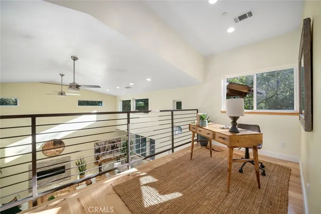 a workspace with furniture window and wooden floor
