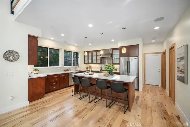 a kitchen with a table and chairs in it