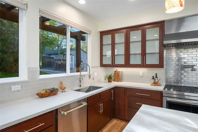 a kitchen with a sink and large window