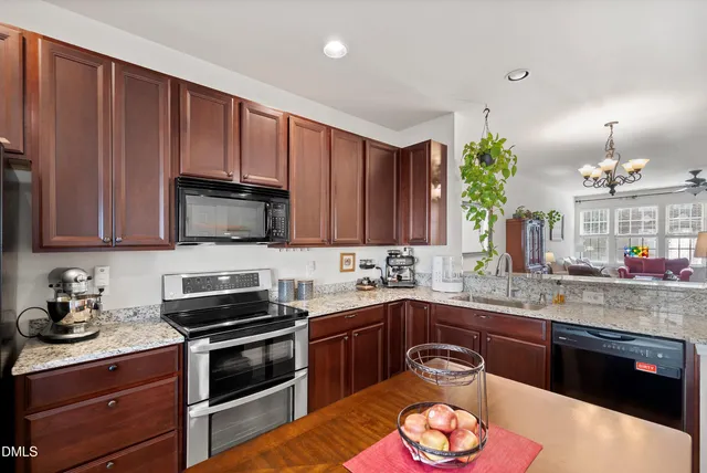 a kitchen with a table and chairs in it