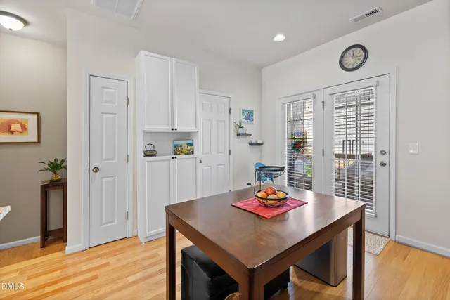 a kitchen with granite countertop a stove microwave and refrigerator