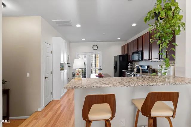 a kitchen with sink and cabinets