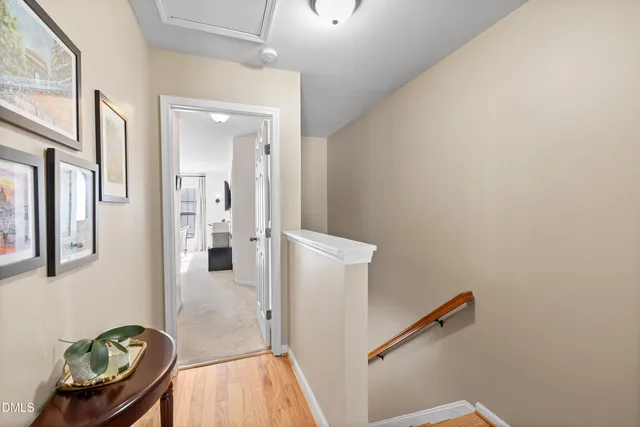 a view of entryway and hall with wooden floor