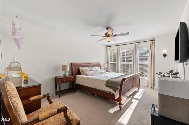 a view of a hallway with couch and chandelier