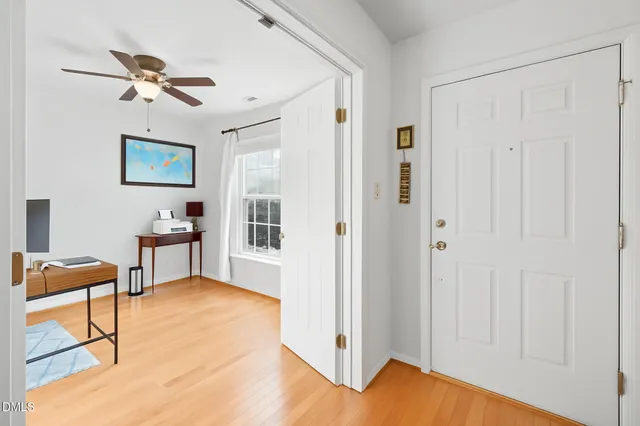 a view of a chairs and table in the balcony