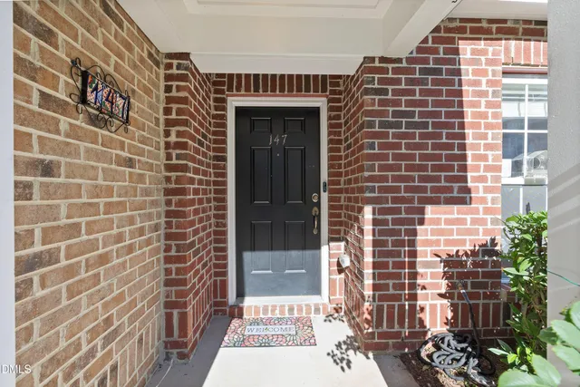 a view of a brick wall with a window