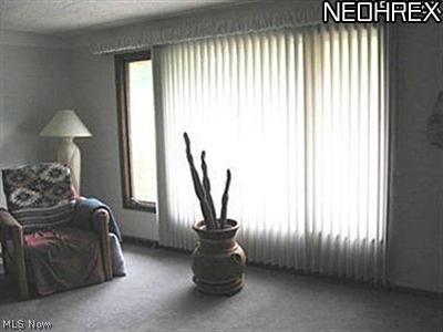 Large picture window in living room that lets in an abundance of natural light