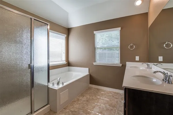 a bathroom with a bathtub and a sink