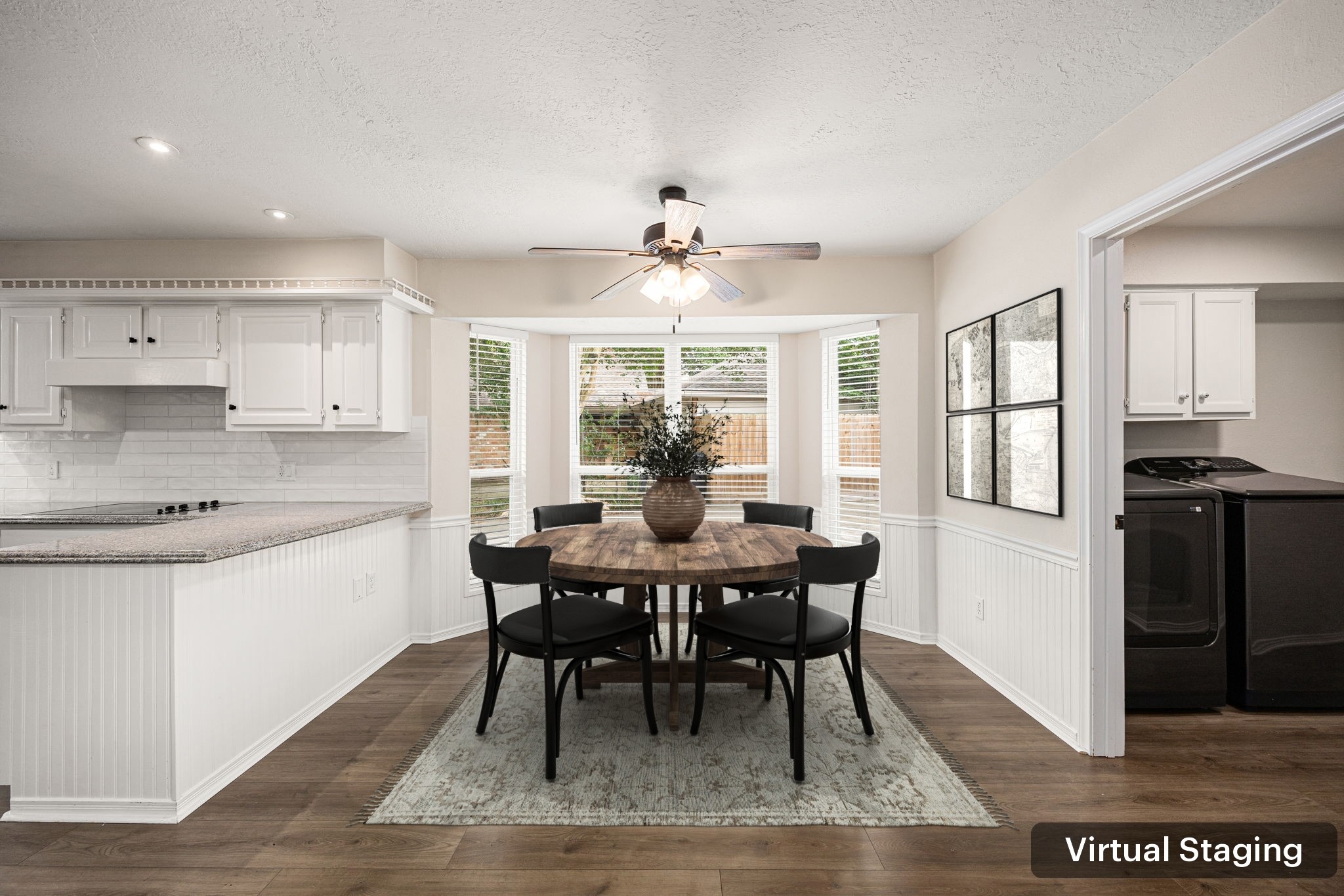 5527 Alamosa Lane Spring, TX 77379 - Photo 11 of 40 a kitchen with stainless steel appliances granite countertop a dining table chairs and a refrigerator