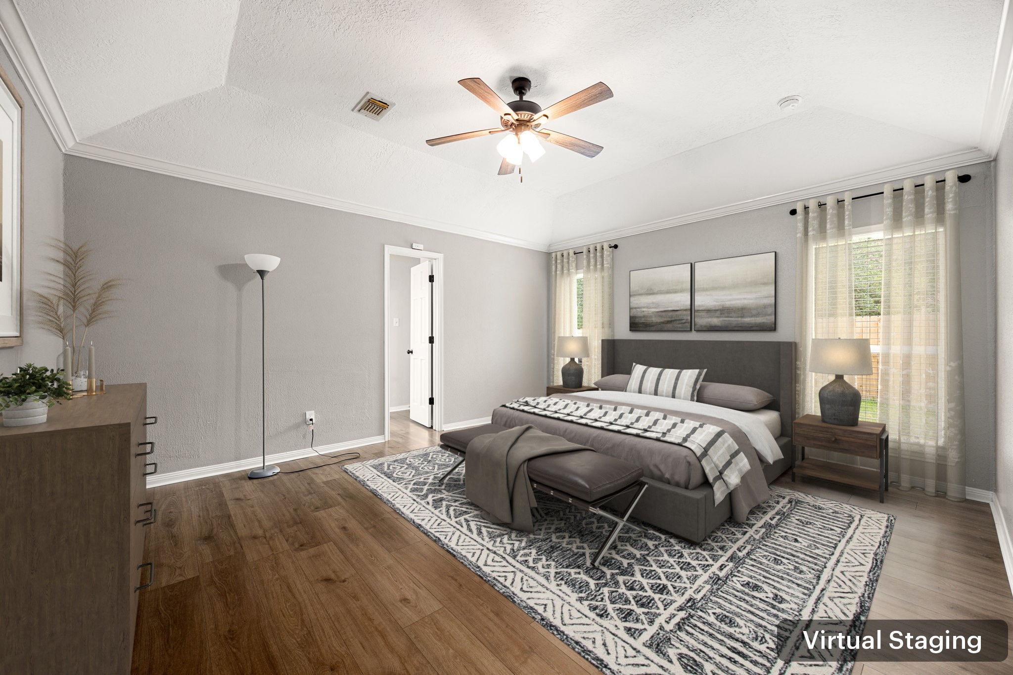 5527 Alamosa Lane Spring, TX 77379 - Photo 13 of 40 a spacious bedroom with a large bed a chandelier and windows