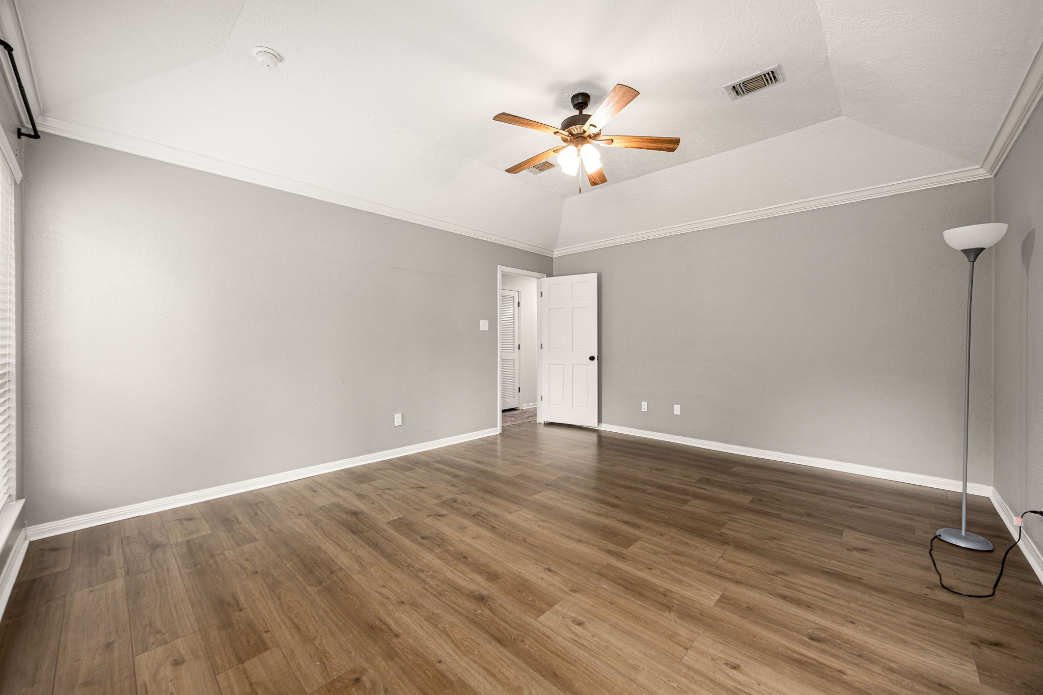 5527 Alamosa Lane Spring, TX 77379 - Photo 14 of 40 a view of an empty room with wooden floor
