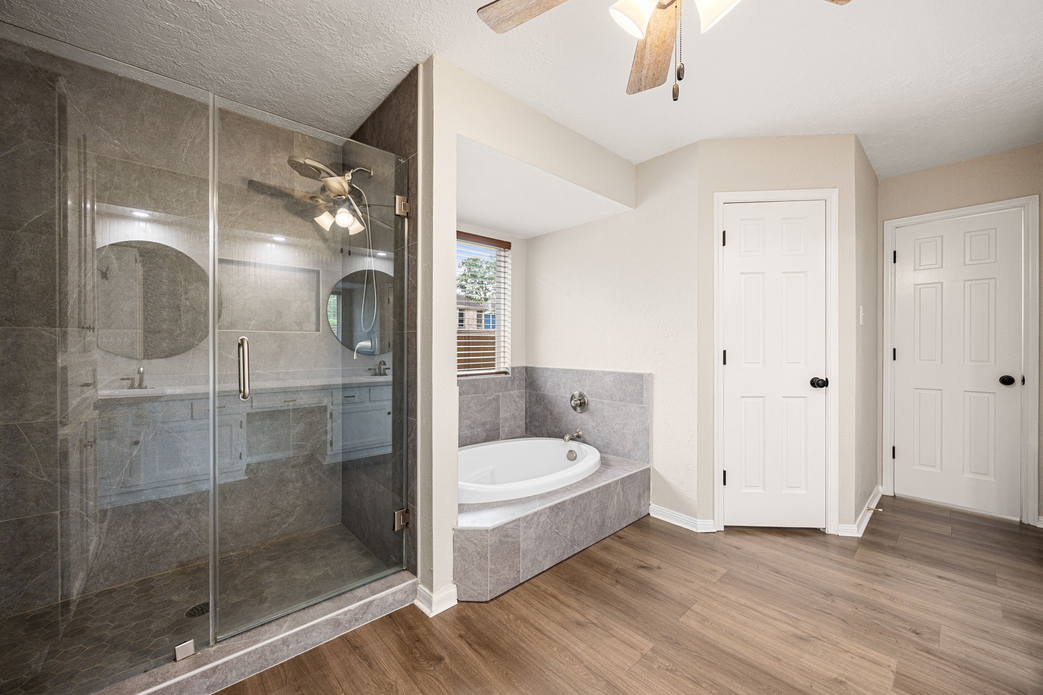 5527 Alamosa Lane Spring, TX 77379 - Photo 16 of 40 a bathroom with a tub shower and sink