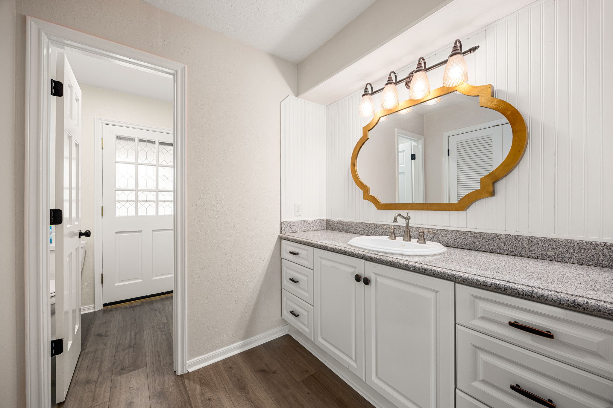 5527 Alamosa Lane Spring, TX 77379 - Photo 20 of 40 a en suite bathroom with a sink and a mirror