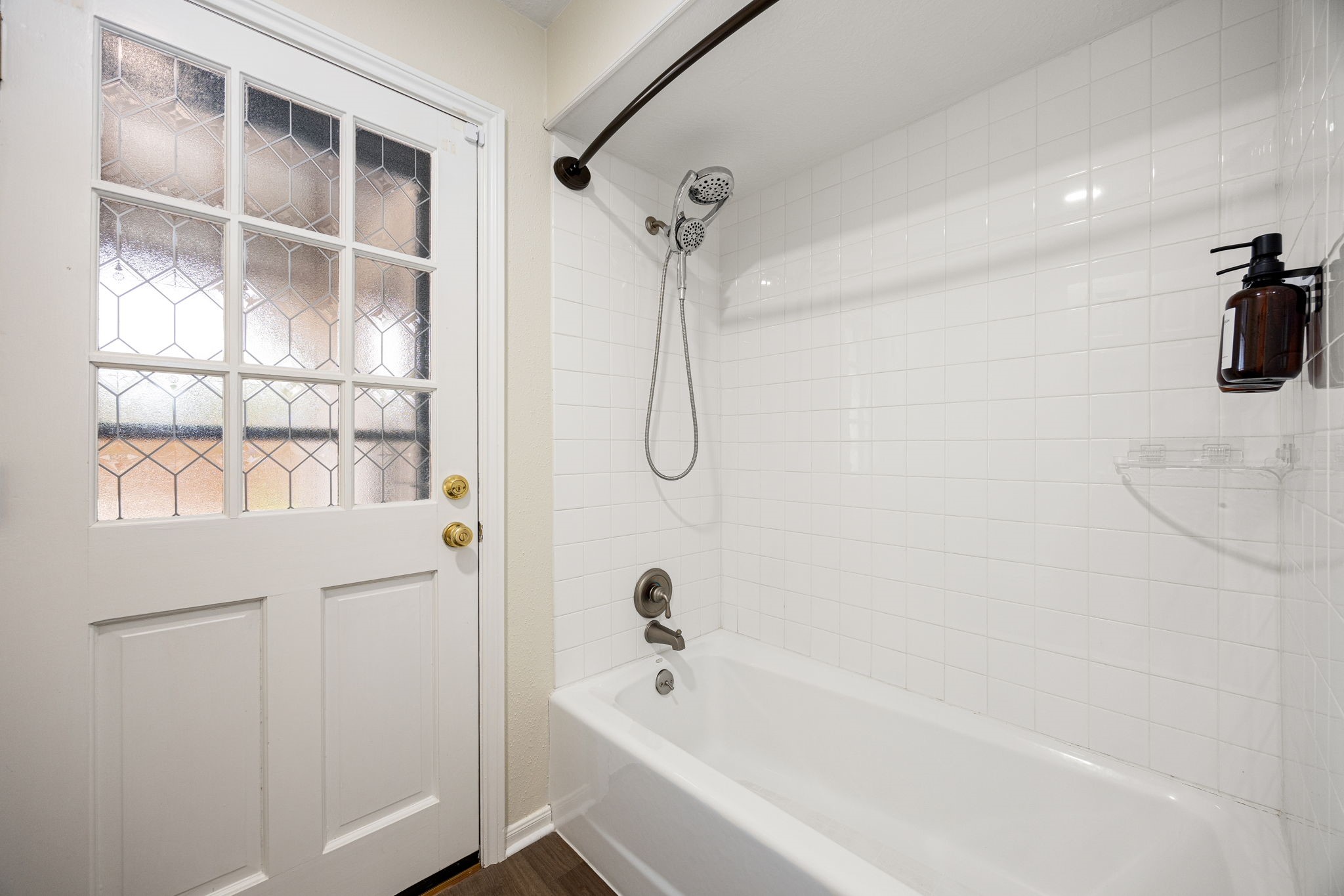 5527 Alamosa Lane Spring, TX 77379 - Photo 21 of 40 a bathroom with a bathtub and a shower
