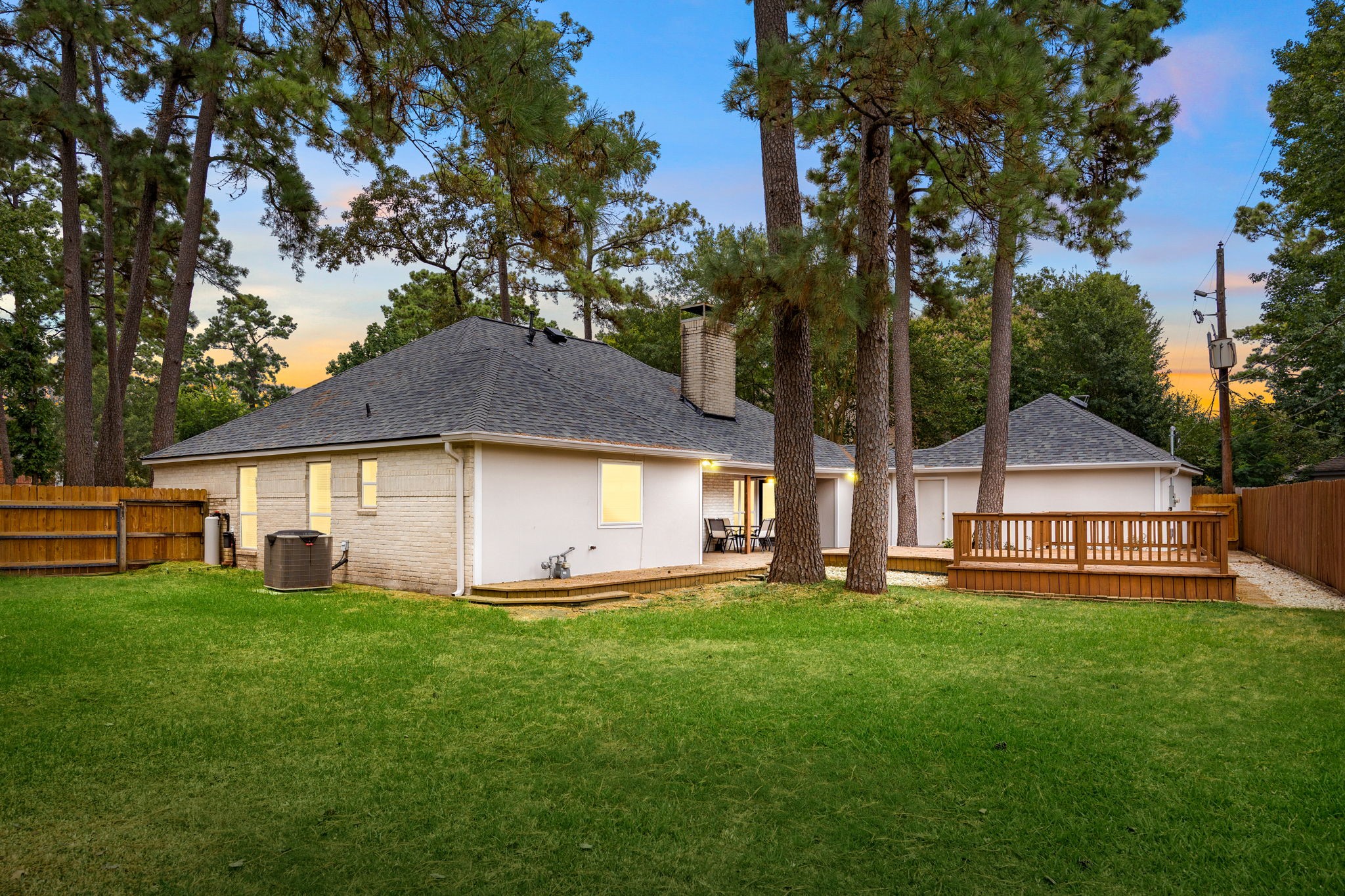 5527 Alamosa Lane Spring, TX 77379 - Photo 29 of 40 a big white house with a big yard and large trees