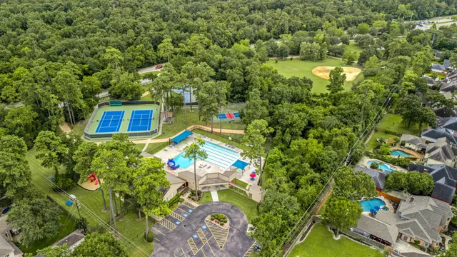 a view of a multi story residential apartment building and trees