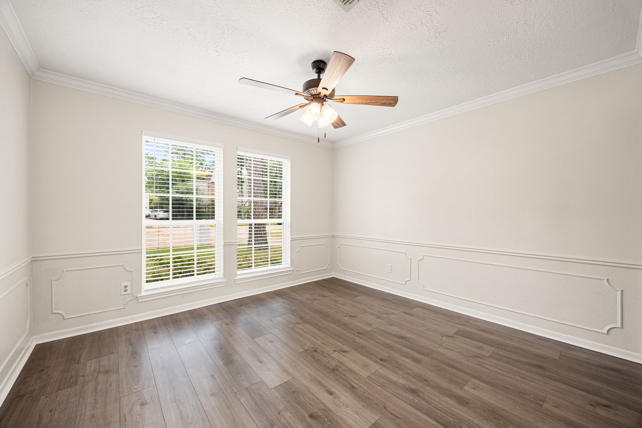 5527 Alamosa Lane Spring, TX 77379 - Photo 5 of 40 an empty room with wooden floor fan and windows