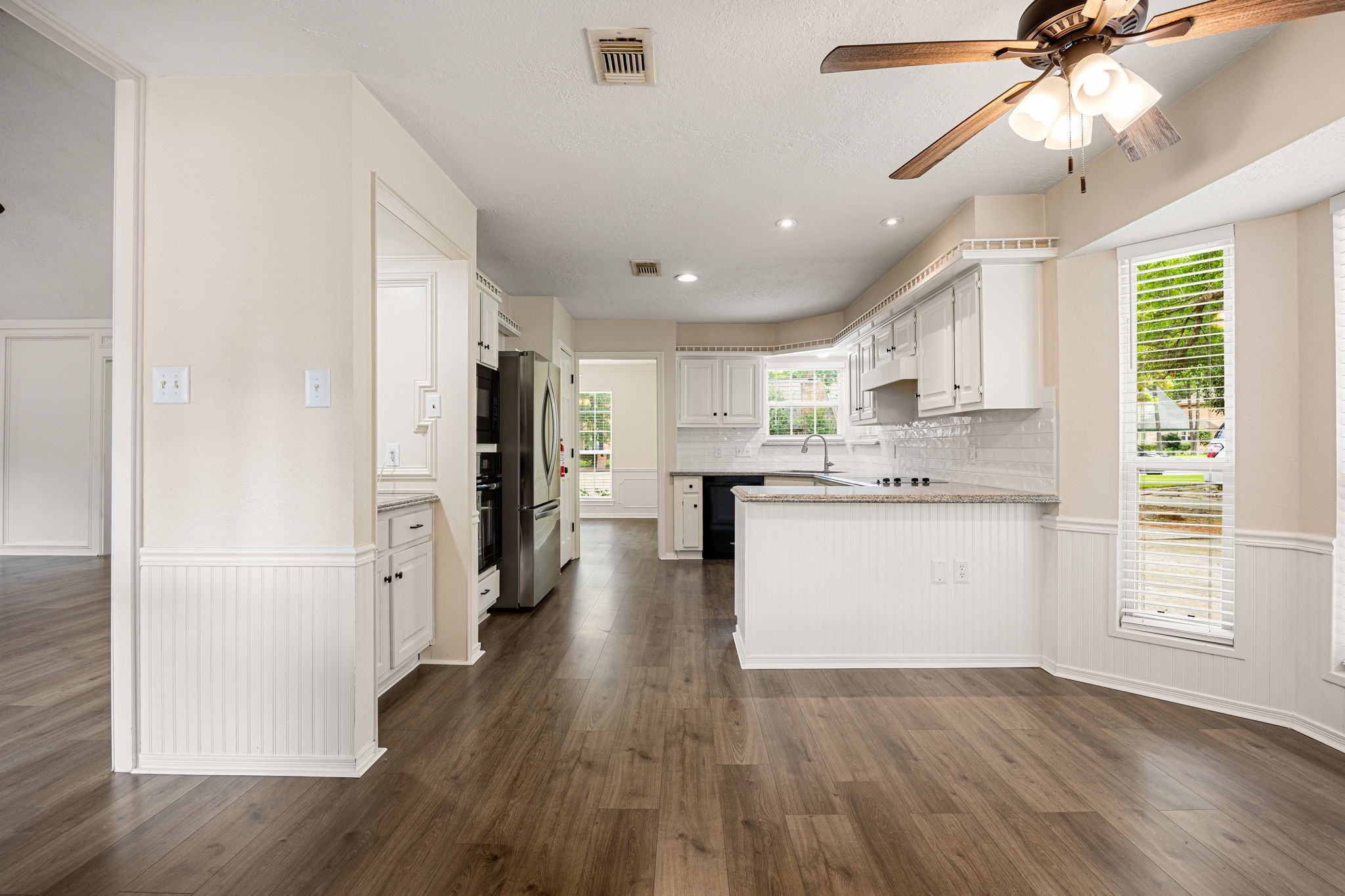 5527 Alamosa Lane Spring, TX 77379 - Photo 10 of 40 a view of a kitchen with a sink a refrigerator and window